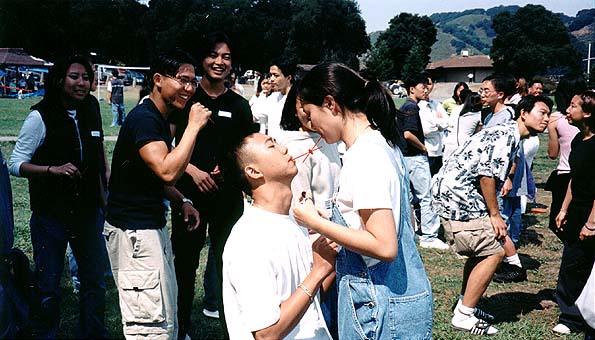 Julie & Tom at the CSA Picnic with candy (Sept 1999)
